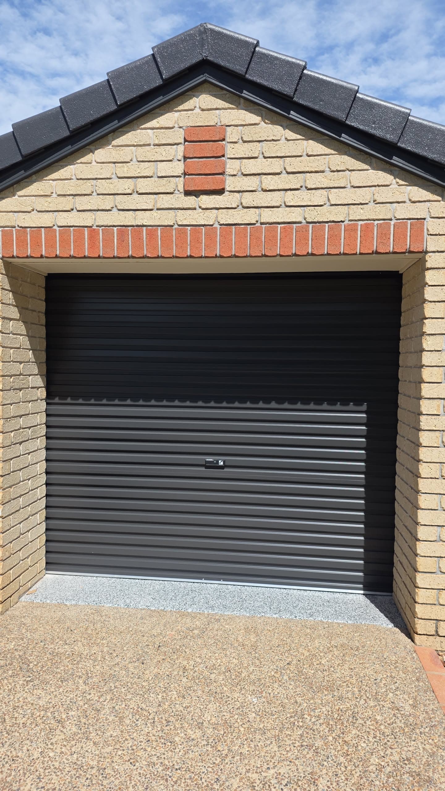 Finished garage door after a Deadlock repair on the Sunshine Coast