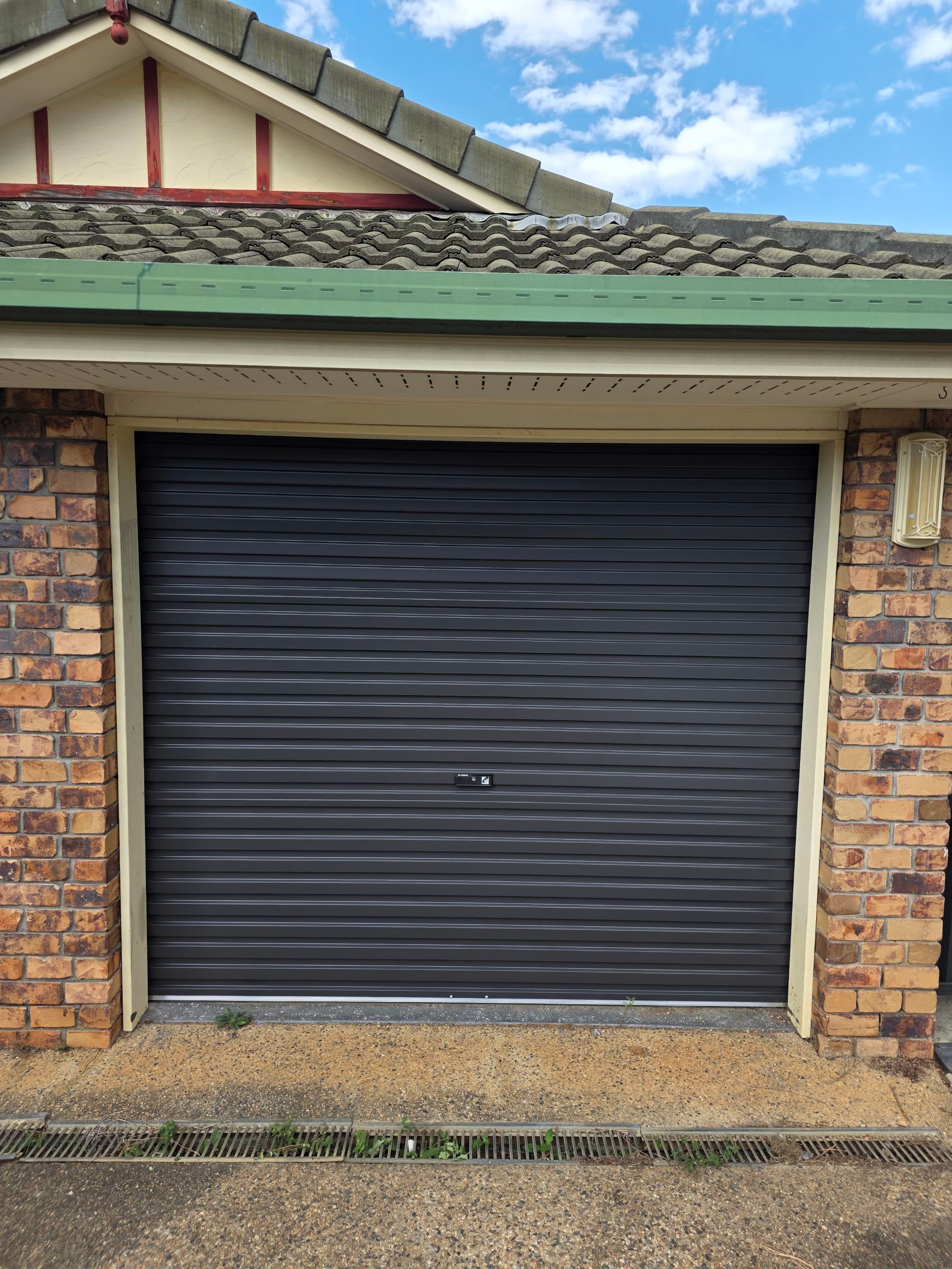 Roller garage door serviced for spring and balance issues