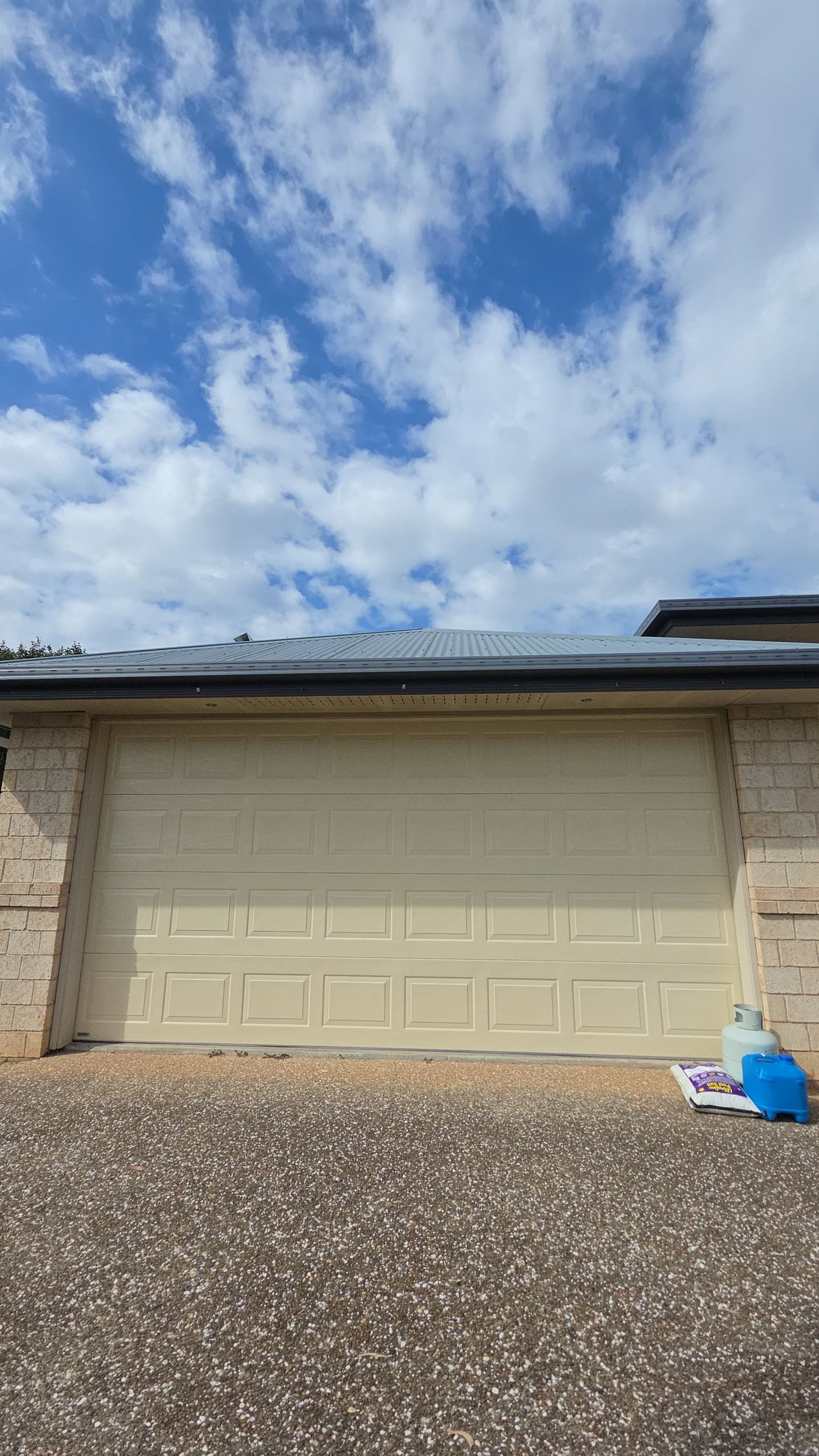 New sectional garage door installed on a Sunshine Coast home