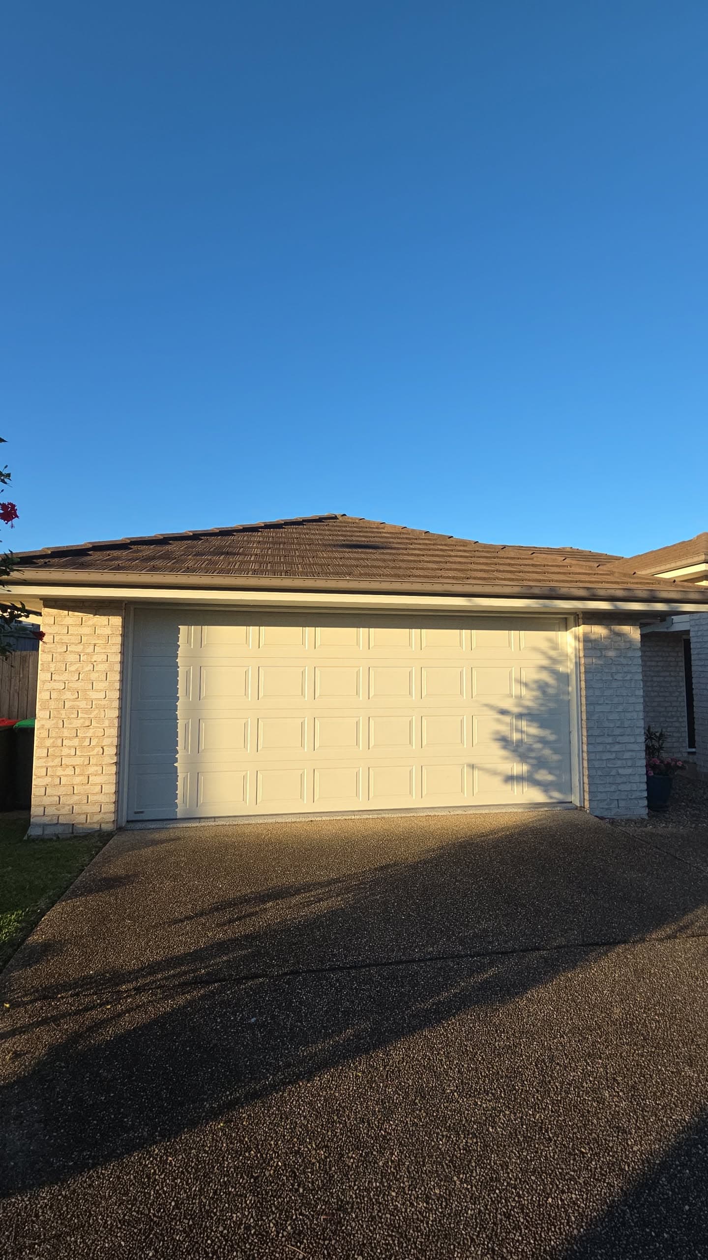 Sectional garage door installed by Deadlock Garage Doors on a Sunshine Coast home